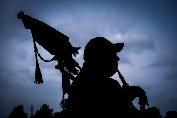 Bagpiper silhouette at the 2023 Golf Outing.