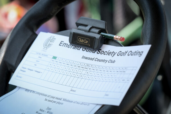 Golf scorecard clipped to a cart during the 2024 Timmy O'Connor Memorial Golf Outing.